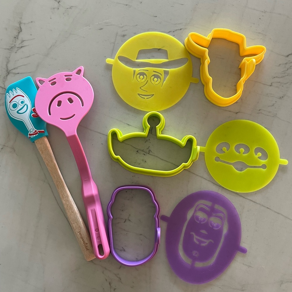 The Pampered Chef Toy Story Utensil Set - Pink, Yellow, Purple